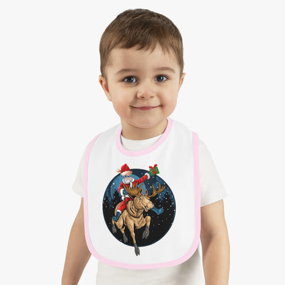Baby Bib - Super kiddo riding a reindeer - [[{"value":"Wonderwear Kid"}]]