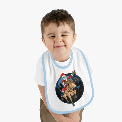 Baby Bib - Super kiddo riding a reindeer - [[{"value":"Wonderwear Kid"}]]