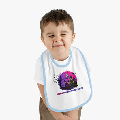 Baby Bib - Super kiddo flying on hunted house - [[{"value":"Wonderwear Kid"}]]