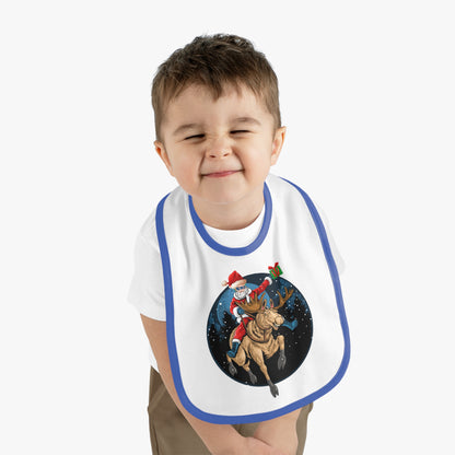 Baby Bib - Super kiddo riding a reindeer - [[{"value":"Wonderwear Kid"}]]