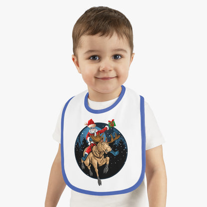 Baby Bib - Super kiddo riding a reindeer - [[{"value":"Wonderwear Kid"}]]