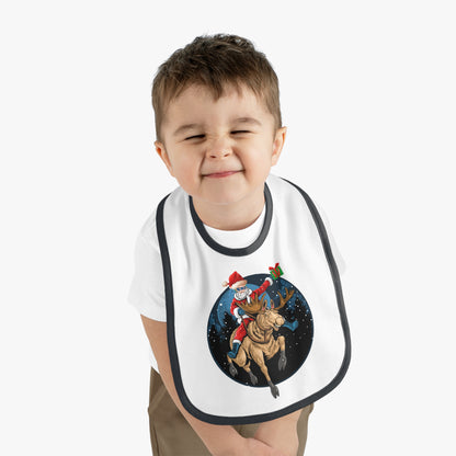 Baby Bib - Super kiddo riding a reindeer - [[{"value":"Wonderwear Kid"}]]