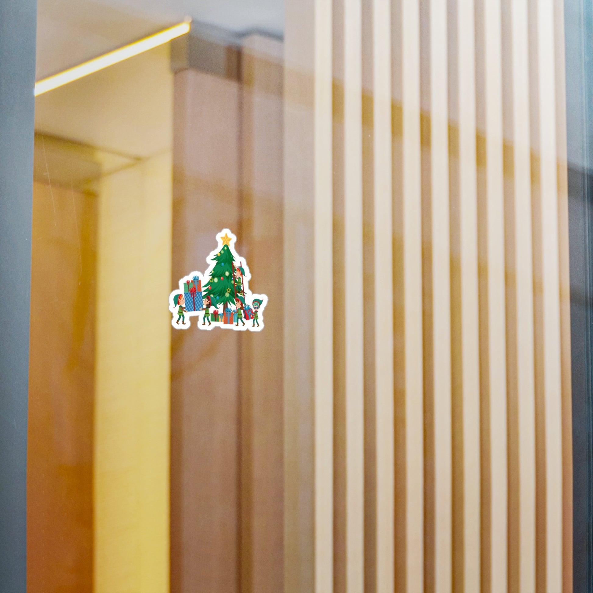 Christmas Kiss-Cut Vinyl Decals – Super kiddo putting gifts on christmas tree - [[{"value":"Wonderwear Kid"}]]