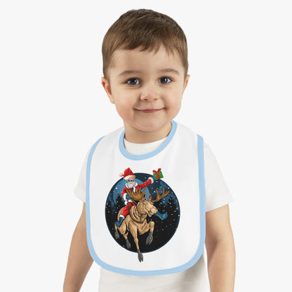 Baby Bib - Super kiddo riding a reindeer - [[{"value":"Wonderwear Kid"}]]
