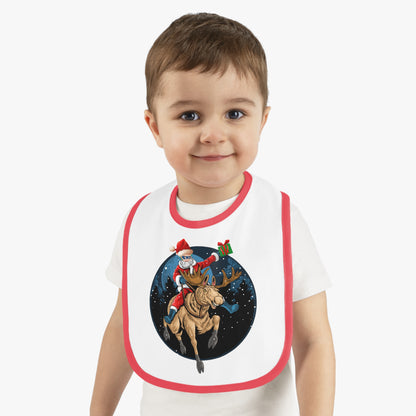 Baby Bib - Super kiddo riding a reindeer - [[{"value":"Wonderwear Kid"}]]